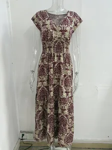 Detailed view of the vintage floral print on a V-neck maxi dress for women.