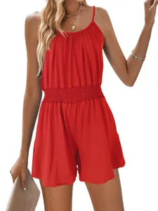 Vibrant red sleeveless romper with spaghetti straps and elasticated waist on model.