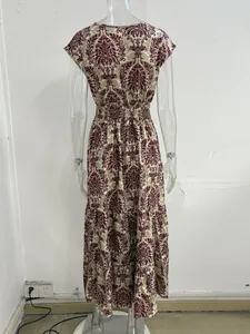 Detailed back view of an elegant vintage damask floral print maxi dress on a mannequin