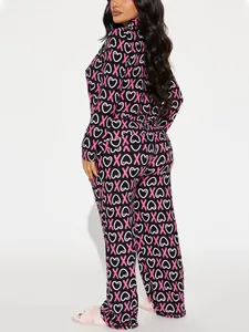 Women's two-piece pajama set featuring black XOXO and heart print on long sleeve top