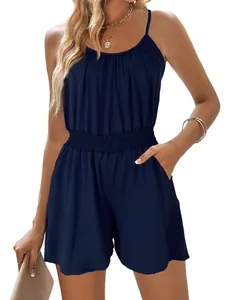 Detailed view of navy blue spaghetti strap romper with smocked waist and pockets