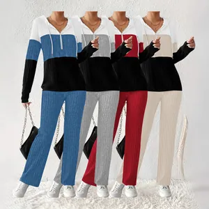 Women's color-block hooded two-piece set featuring ribbed knit sweatshirt and pants in multiple colors