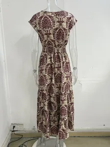 Back view of retro damask print maxi dress on a clear plastic mannequin for women