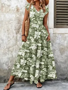 Detail view showing full length of tropical leaf print maxi dress with V-neckline