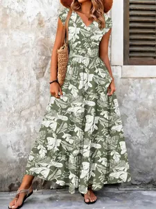 Detail view showing full length of tropical leaf print maxi dress with V-neckline