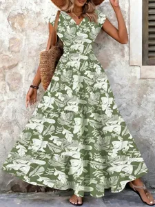 Elegant green and white floral print V-neck maxi dress featuring a stylish tiered skirt design