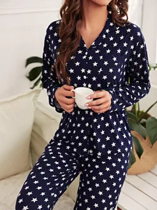 Women's navy blue pajama set with white star print, button-down top and long pants.