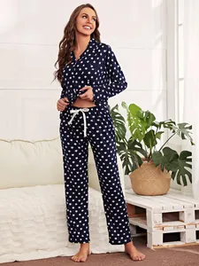 Full-body view of women's star print long-sleeve pajama set in a cozy room