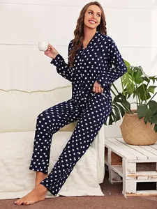 Cozy women's navy blue pajama set featuring a white star print and long sleeves