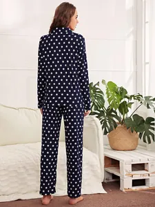Back view of women's navy blue star print pajama set with long sleeves and pants