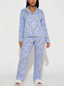 Detailed view of women's light blue floral print pajama set featuring long sleeves and a lapel collar