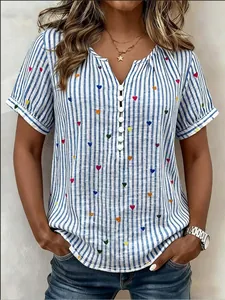 Detail shot of women's blue striped shirt featuring colorful heart print and v-neck