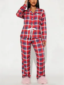 Detailed view of women's red and blue plaid pajama set with long sleeves and pants.
