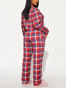 Back view of a women's red plaid pajama set featuring long sleeves and matching pants
