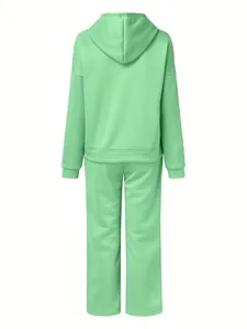 Back view of a mint green women's hooded tracksuit two-piece set in a loose fit