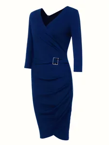 Detailed view of navy blue V-neck dress featuring ruched waist and silver buckle detail