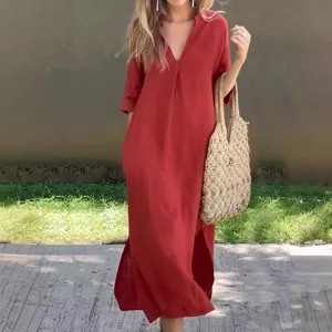 Detail view of summer v-neck long dress with elegant front pleats and side slits