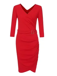 Detailed view of the red V-neck dress featuring three-quarter sleeves and ruched waist