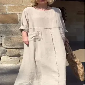 Casual loose linen maxi dress with front pockets and raw edge seams in beige