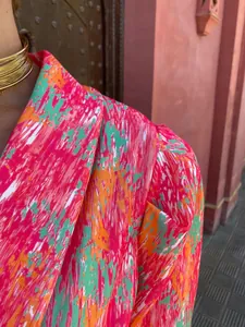Close-up detail of vibrant dopamine print puff sleeve romper for women summer fashion