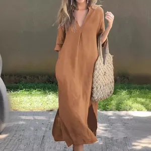 Full view of elegant women's camel summer maxi dress with V-neck and side slits