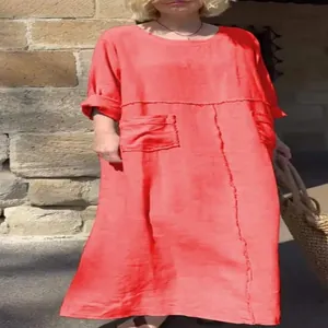 Casual red cotton linen maxi dress with round neck, long sleeves and side pockets detail