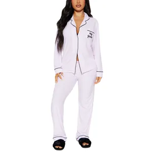 Elegant women's pink striped pajama set featuring long sleeves and nap queen pocket detail