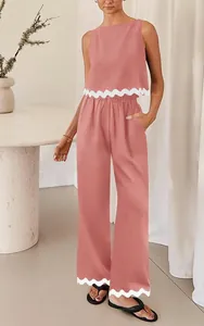 Casual pink sleeveless tank top and wide-leg pants set with stylish white wavy trim