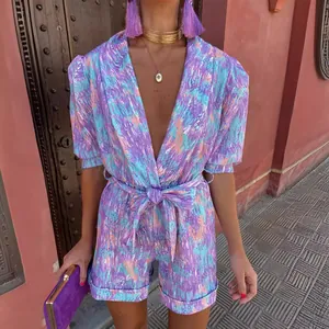 Vibrant summer deep V-neck puff sleeve printed romper with elastic tie waist for women.