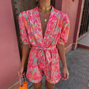 Vibrant summer floral print romper for women featuring deep V-neck and stylish puff sleeves