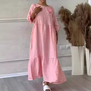 Elegant pink round neck long sleeve tiered maxi dress with 3D floral accent and ruffles