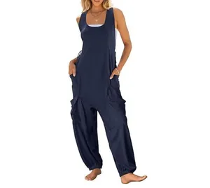 Detail view of navy blue sleeveless jumpsuit for women with functional side cargo pockets