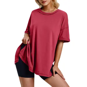 Close-up view of a red oversized cotton T-shirt featuring side slits and a comfortable crew neck