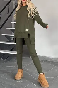 Women's olive green two-piece casual set featuring side slit long sleeve top and leggings