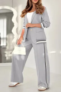 Elegant grey two-piece suit set for women with stylish black and white ribbed trim detail