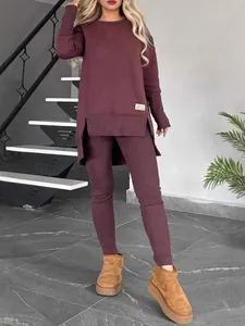 Burgundy two-piece lounge set with long sleeve side slit top and matching leggings