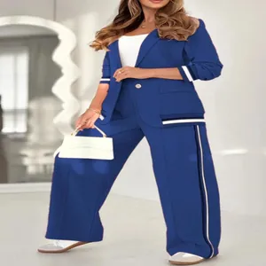 Blue two-piece formal blazer and wide-leg trousers set with stylish ribbed stripe details.