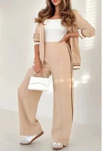 Elegant beige two-piece blazer and wide-leg trousers set with ribbed cuff detail