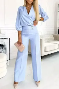 Elegant light blue V-neck two-piece set with puffed sleeves and wide-leg pants