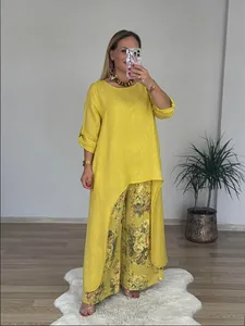 Lässiges gelbes Leinen-Set für Damen mit asymmetrischem Oberteil und floraler weiter Hose