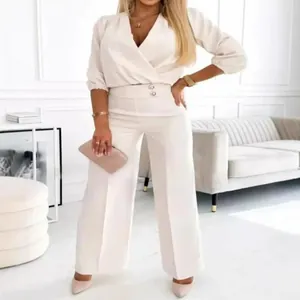 Elegant white two-piece set with V-neck wrap top and high-waisted wide-leg trousers