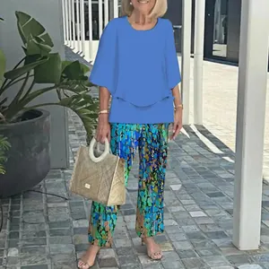 Women's casual two-piece outfit featuring a blue round neck top and floral pants