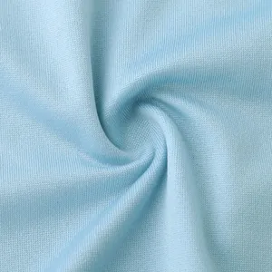 Macro detail of soft light blue knit fabric texture for women's summer dress