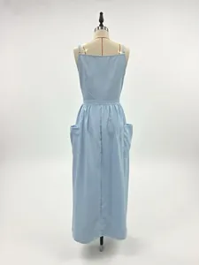 Back view of a light blue sleeveless maxi sundress with large pockets on studio mannequin