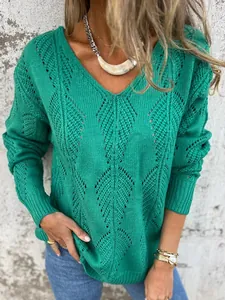 Detail view of green V-neck knit sweater featuring hollow leaf patterns for women