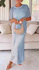 Women's light blue round neck hollow-out knit two-piece maxi dress in indoor setting