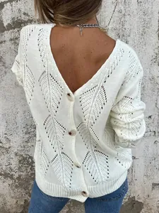 Close-up of stylish white knitted sweater with hollow leaf pattern and back buttons