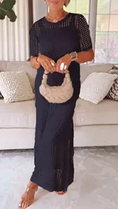 Chic black hollow-out two-piece maxi dress featuring a round neck and short sleeves for summer.