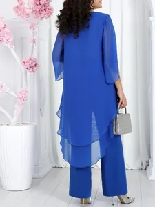Back view of elegant royal blue chiffon 2-piece set featuring a tiered high-low top and pants