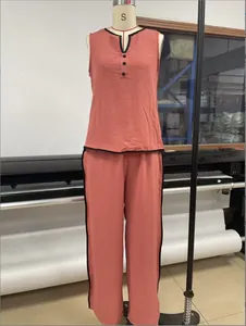 Detailed view of women's sleeveless V-neck lounge set with black contrast trim